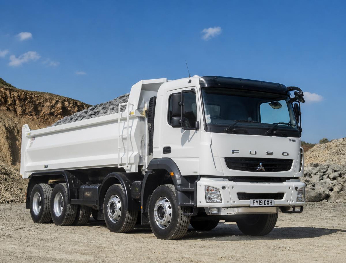 Rexaco tipper truck delivering aggregates to a construction site