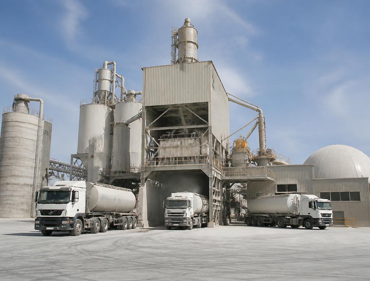 Rexaco bulk trucks loading clinker at a cement plant
